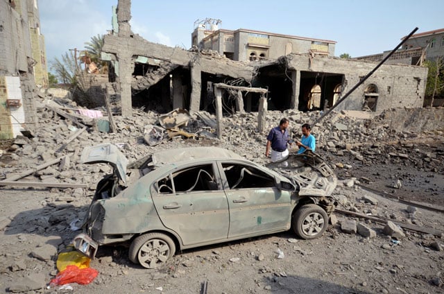 people stand at the site of a saudi led air strike in the red sea port city of houdieda yemen september 5 2016 photo reuters