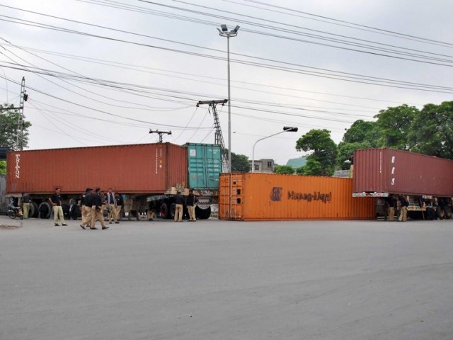 cordoning off authorities impound dozens of containers