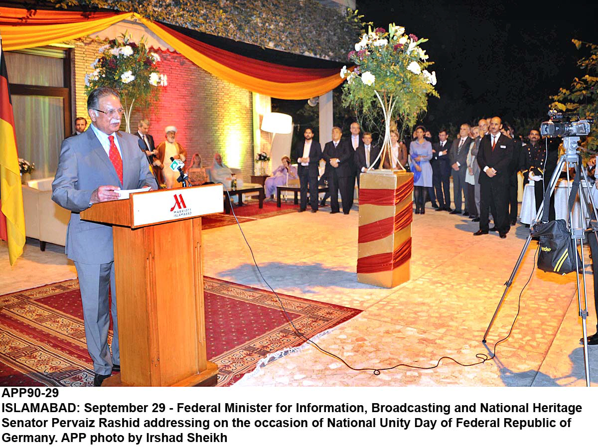 senator parvaiz rashid addressing on the occasion of national unity day of federal republic of germany photo app