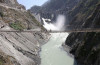 labourers walk on a bridge near the newly inaugurated 450 megawatt hydropower project located at baglihar dam on the chenab river which flows from indian kashmir into pakistan at chanderkote about 145 km 90 miles north of jammu october 10 2008 reuters