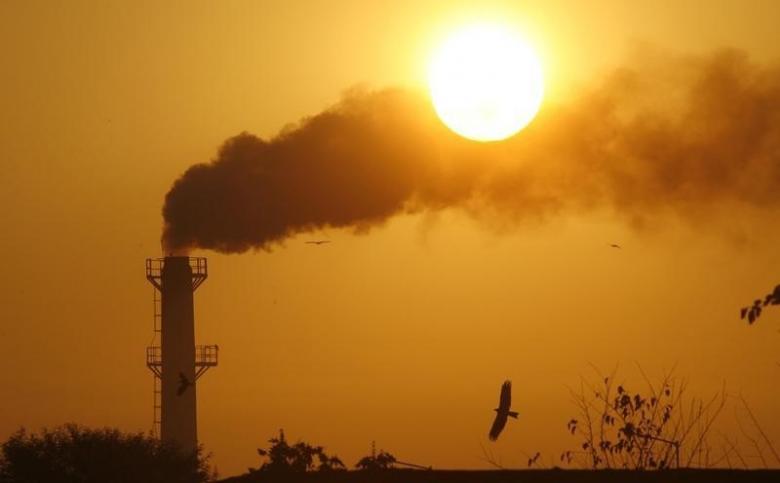 smoke rises from a chimney of a garbage processing plant on the outskirts of chandigarh december 3 2011 photo reuters