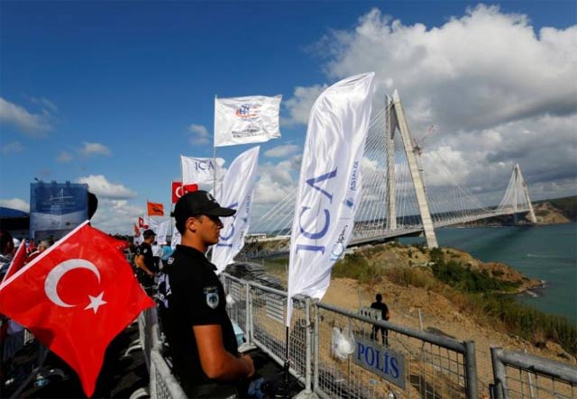 a riot police stands guard during the opening ceremony of newly built yavuz sultan selim bridge the third bridge over the bosphorus linking the city 039 s european and asian sides in istanbul turkey photo reuters