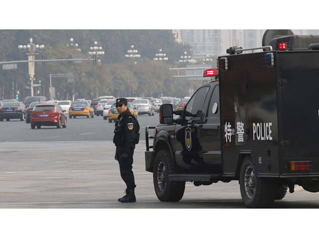 file photo of a chinese police personnel standing guard photo reuters