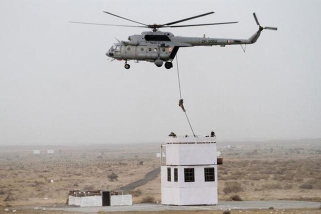 indian air force 039 garuda 039 commandos descend from a helicopter during iaf exercise iron fist 2016 at pokhran in the western indian state of rajasthan on march 18 2016 photo afp