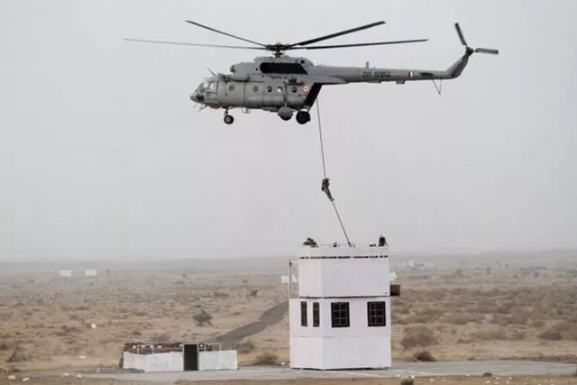 indian air force 039 garuda 039 commandos descend from a helicopter during iaf exercise iron fist 2016 at pokhran in the western indian state of rajasthan on march 18 2016 photo afp indian air force 039 garuda 039 commandos descend from a helicopter during iaf exercise iron fist 2016 at pokhran in the western indian state of rajasthan on march 18 2016 photo afp