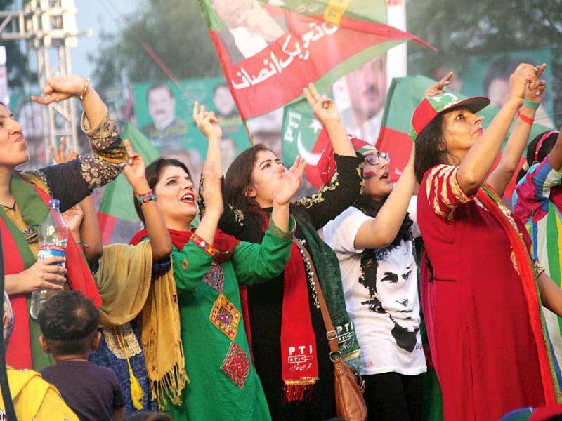 women dance to music at adda plot hours before the pti s rally actually started with the arrival of imran khan photo abid nawaz express