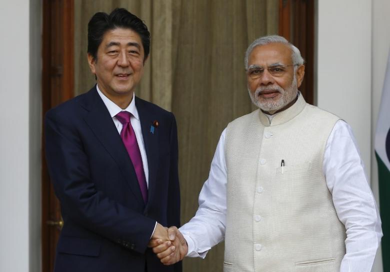 japan 039 s prime minister shinzo abe l shakes hands with his indian counterpart narendra modi during a photo opportunity ahead of their meeting at hyderabad house in new delhi december 12 2015 photo reuters