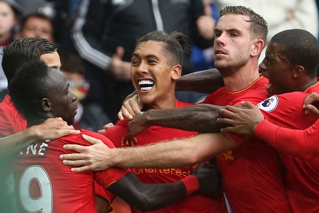 liverpool 039 s brazilian midfielder roberto firmino c celebrates scoring their first goal to equalise 1 1 during the english premier league football match between swansea city and liverpool at the liberty stadium in swansea south wales on october 1 2016 photo afp