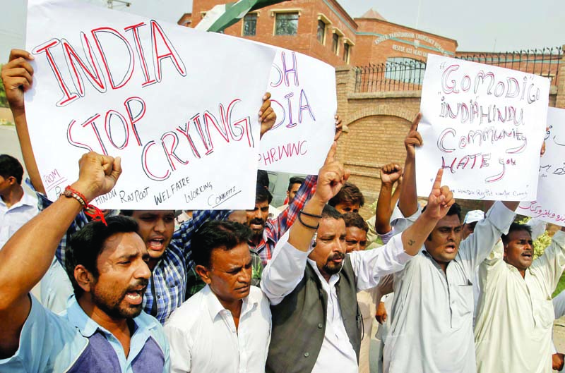 members of the hindu community chant slogans against the indian government during a protest in peshawar photo ppi