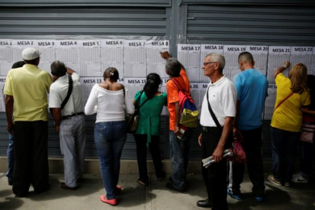 colombians look for their identification numbers on lists outside the colombian consulate before voting in a referendum on a peace deal between the government and revolutionary armed forces of colombia farc rebels in caracas venezuela october 2 2016 photo reuters colombians look for their identification numbers on lists outside the colombian consulate before voting in a referendum on a peace deal between the government and revolutionary armed forces of colombia farc rebels in caracas venezuela october 2 2016 photo reuters