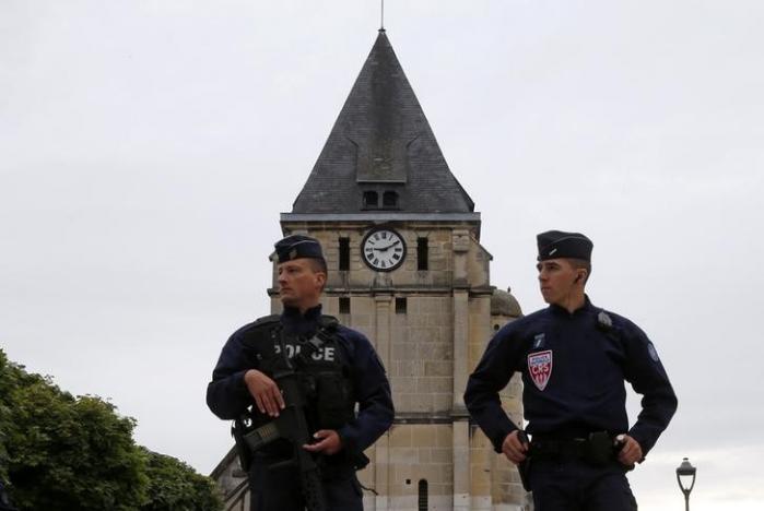 french crs police stand guard in front of the church a day after a hostage taking in saint etienne du rouvray near rouen in normandy france photo reuters