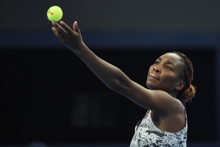 venus williams of the us serves against china 039 s peng shuai during their women 039 s singles first round match at the china open tennis tournament in beijing on october 3 2016 photo reuters