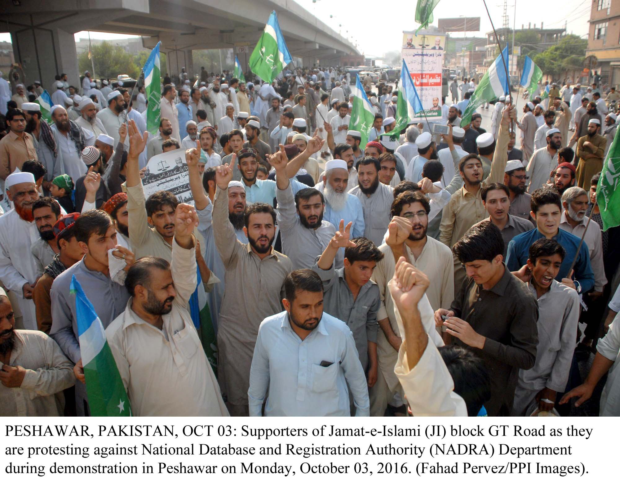 supporters of ji block gt road as they protest against nadra department during demonstration in peshawar on monday photo ppi