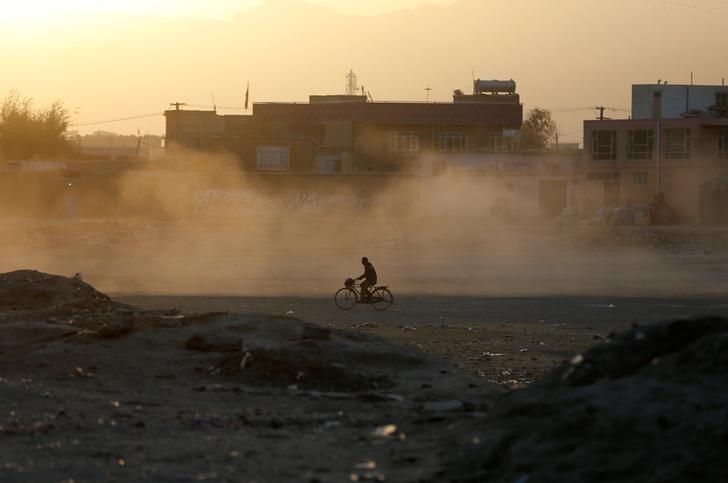 an afghan man rides a bicycle during sunrise in kabul afghanistan october 3 2016 photo reuters