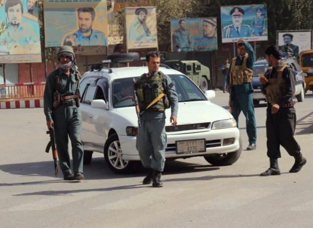 afghan policemen keep watch in the downtown of kunduz city afghanistan october 3 2016 photo reuters
