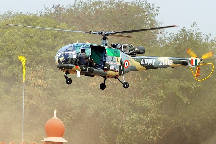 in this photograph taken on january 28 2010 an indian army chetak helicopter a licence built version of the french alouette iii and successor of the smaller cheetah utility helicopter makes a fly past during a national cadet corps ncc parade in new delhi photo afp