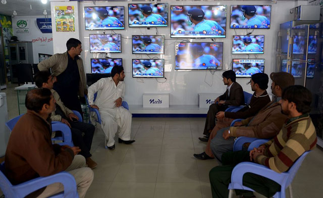 shopkeepers in rawalpindi watching a cricket match between pakistan and india photo afp file