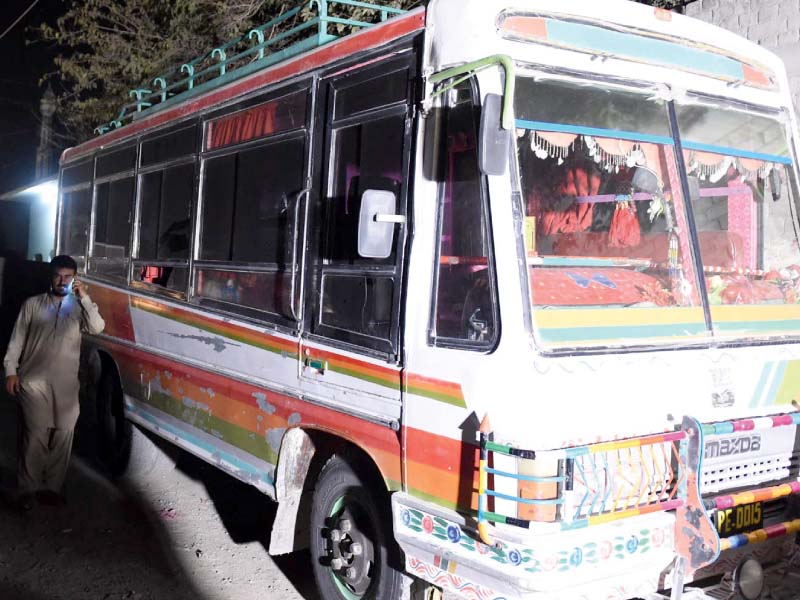 a man walks beside the bus that was targeted by armed gunmen photo inp