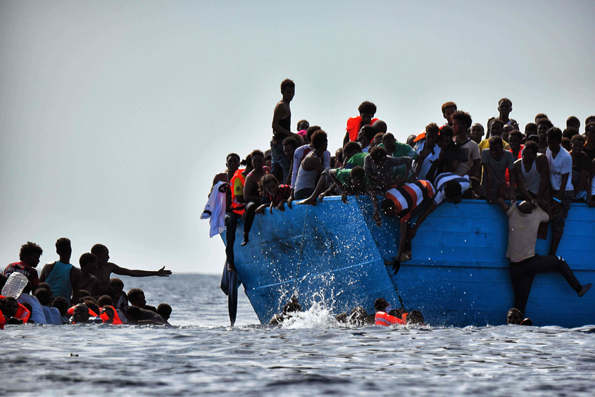 migrants wait to be rescued by members of proactiva open arms ngo in the mediterranean sea some 12 nautical miles north of libya on october 4 2016 photo afp