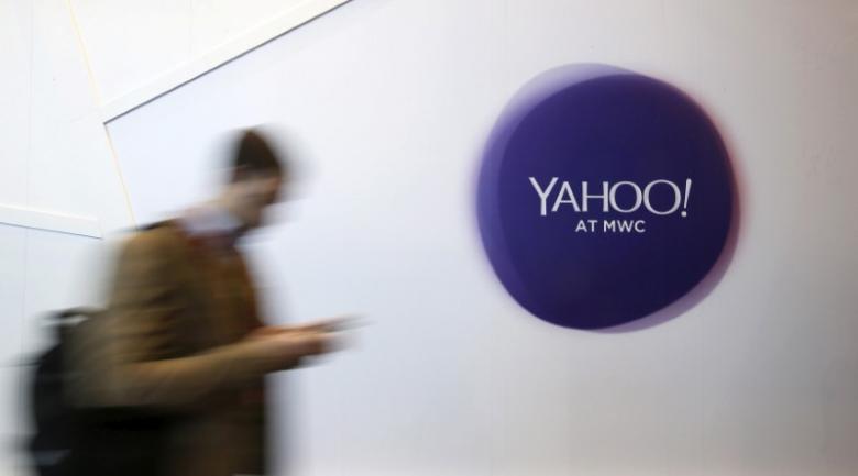 a man walks past a yahoo logo during the mobile world congress in barcelona spain in this february 24 2016 file photo photo reuters