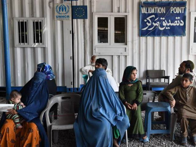afghan refugees wait at the unhcr registration center in peshawar on june 23 2016 photo afp afghan refugees wait at the unhcr registration center in peshawar on june 23 2016 photo afp