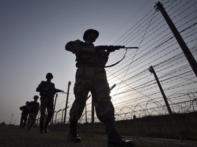 indian border security force bsf soldiers patrol the fenced border with pakistan in suchetgarh southwest of jammu january 16 2013 photo reuters