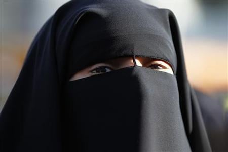 hind ahmas wears a niqab despite a nationwide ban on the islamic face veil outside the courts where she arrived with the intention to pay a fine after she was arrested last may for wearing the niqab in public in meaux east of paris photo reuters