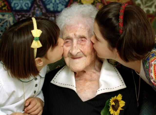 the world 039 s oldest woman jeanne calment 120 years old is kissed by two young girls during a special ceremony in a retirement home in arles southern france february 21 1995 photo reuters