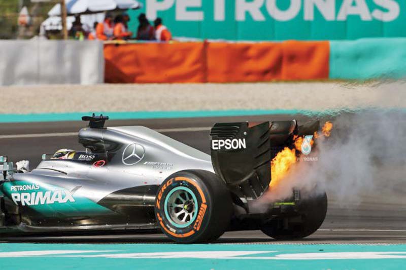 hamilton would have in all likelihood regained the championship lead had his car not burst in flames at the malaysian gp photo afp