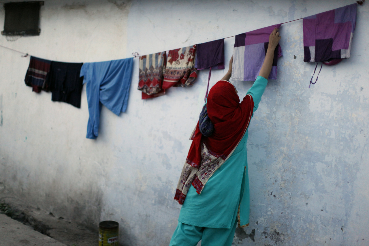 a woman hangs laundry to dry outside her house in rawalpindi near pakistan 039 s capital islamabad may 1 2009 photo reuters