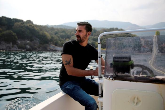 greek fisherman stratis valamios 40 a nobel peace prize nominee is seen onboard his motorboat at the sea near the skala sikamias village on the island of lesbos greece photo reuters