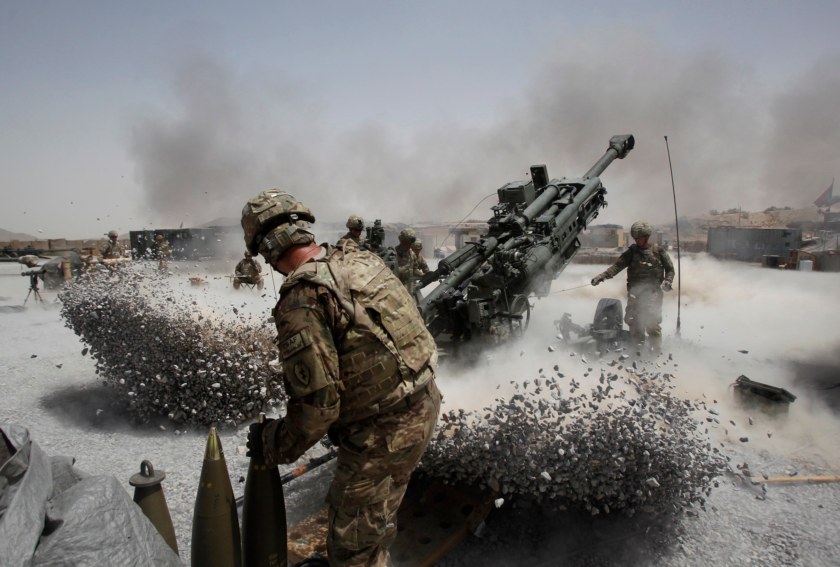 us army soldiers from the 2nd platoon b battery 2 8 field artillery fire a howitzer artillery piece at seprwan ghar forward fire base in panjwai district kandahar province southern afghanistan june 12 2011 photo reuters