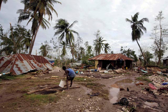 a man gets water from a well in an area destroyed by hurricane matthew in cavaillon haiti october 6 2016 photo reuters