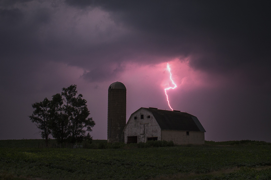 a lighting strike and heavy rain clouds are seen over a barn surrounded by fields of soybeans in donnellson iowa us photo reuters