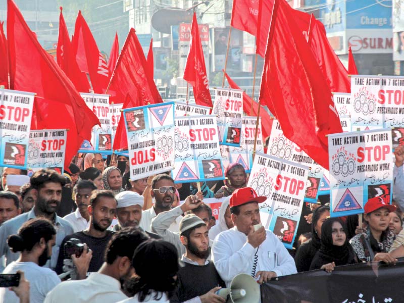 a large number of home based workers and labourers took to the streets on friday to demand job and workplace security after a demonstration at regal chowk they marched to the karachi press club photo athar khan express