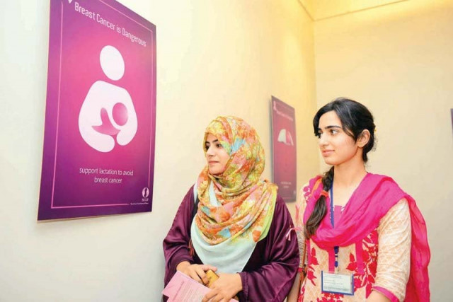 participants take keen interest in a poster exhibited in university s minhas art gallery photo express