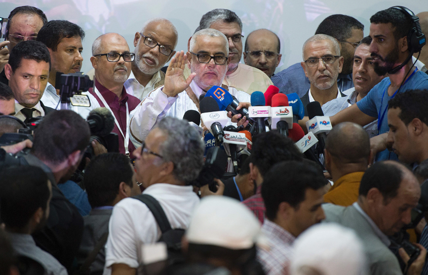 moroccan prime minister and secretary general of the ruling extremist justice and development party pjd abdelilah benkirane talks in a conference after the announcement of preliminary results of the 2016 photo afp