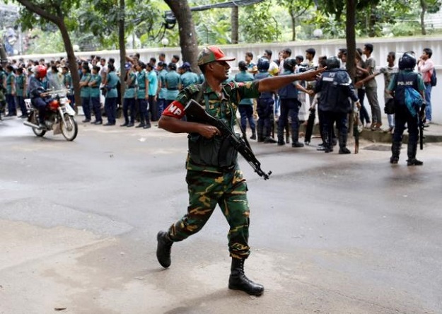a security personnel reacts near the holey artisan restaurant after gunmen attacked the upscale cafe in dhaka bangladesh photo reuters