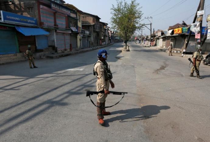 indian policemen stand guard in a deserted street during a curfew in srinagar september 30 2016 photo reuters