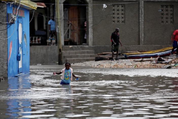 a girl walks in a flooded area after hurricane matthew in les cayes haiti october 5 2016 photo reuters