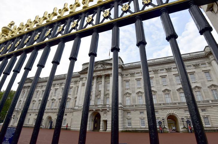 buckingham palace is seen through the perimeter fence in central london britain photo reuters