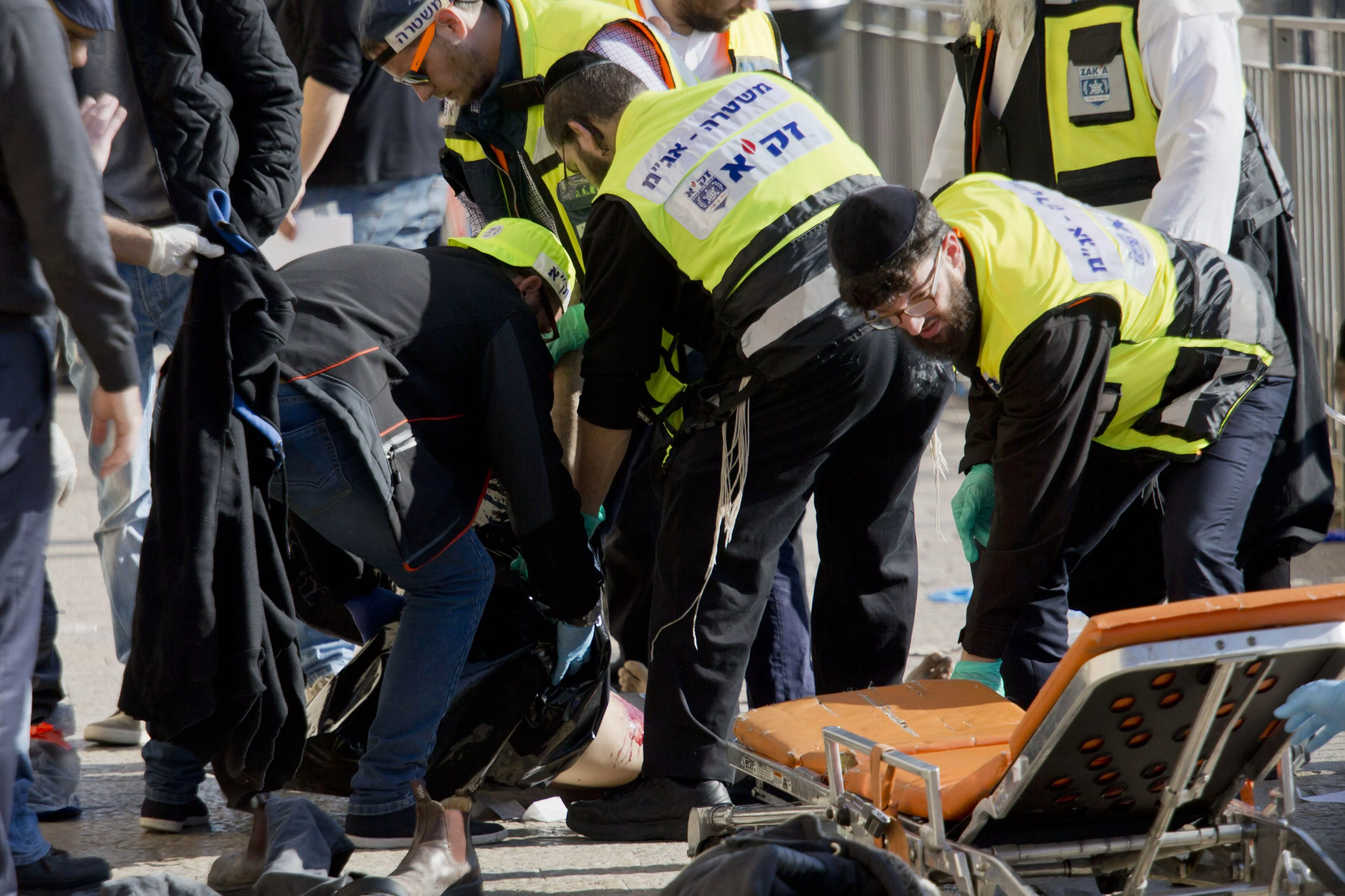 israeli emergency services officers evacuate the body of a palestinian assailant form the site outside jerusalem s old city wednesday dec 23 2015 photo ap israeli emergency services officers evacuate the body of a palestinian assailant form the site outside jerusalem s old city wednesday dec 23 2015 photo ap