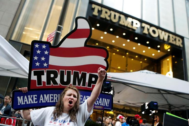 supporters of republican presidential nominee donald trump stand outside trump tower where trump lives in the manhattan borough of new york us photo reuters