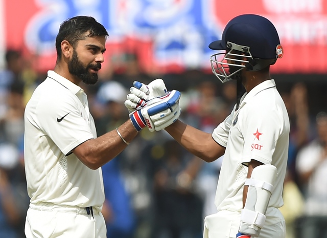 india 039 s batsman and captain virat kohli l celebrates with a teammate ajinkya rahane after scoring a double century during the second day of third test cricket match between india and new zealand at the holkar cricket stadium in indore on october 9 2016 photo afp