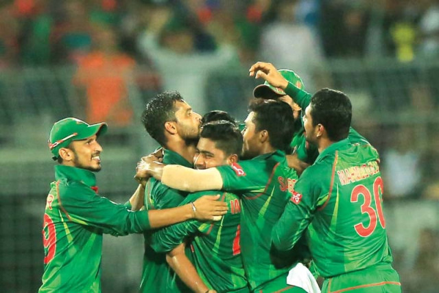 bangladesh cricketers congratulate mortaza 2l after he went through stokes defences to hit timber and leave the visitors in trouble at 29 4 in the second odi photo afp