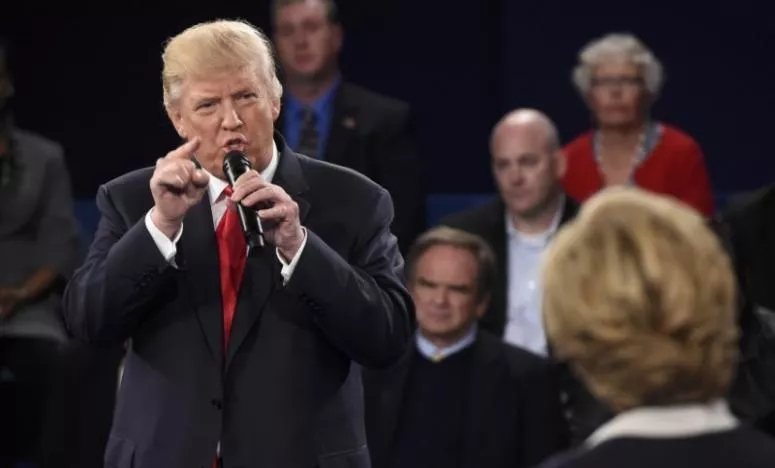republican us presidential nominee donald trump speaks as democratic us presidential nominee hillary clinton r listens during their presidential town hall debate photo reuters republican us presidential nominee donald trump speaks as democratic us presidential nominee hillary clinton r listens during their presidential town hall debate photo reuters