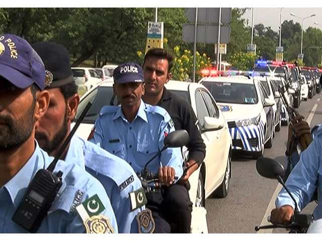 police and personnel of other law enforcement agencies during a flag march ahead of ashura in islamabad on october 6 2016 photo waseem nazir express