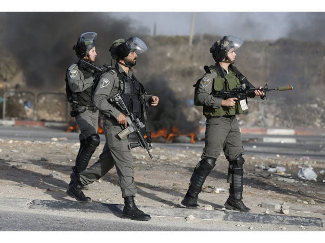 israeli border guards keep position during clashes with palestinian youths in the west bank town of al ram north of jerusalem on october 9 2016 photo afp israeli border guards keep position during clashes with palestinian youths in the west bank town of al ram north of jerusalem on october 9 2016 photo afp