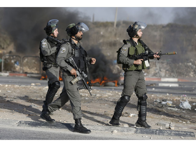 israeli border guards keep position during clashes with palestinian youths in the west bank town of al ram north of jerusalem on october 9 2016 photo afp