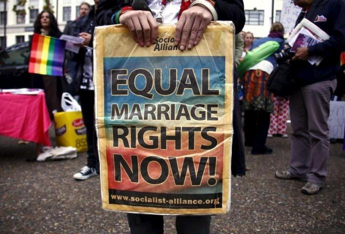 a gay rights activist holds a placard during a rally supporting same sex marriage in sydney australia may 31 2015 photo reuters